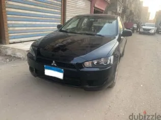 ميتسوبيشي لانسر 2014 أسود مستعملة للبيع
